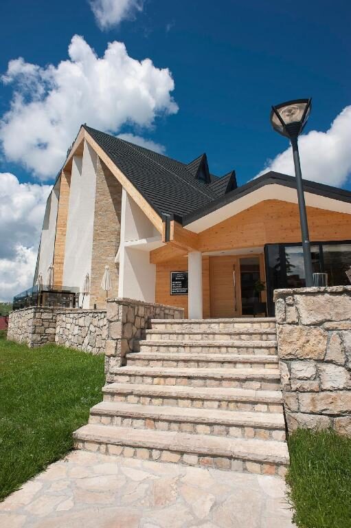 Entrance stairs of Hotel Žabljak in summer